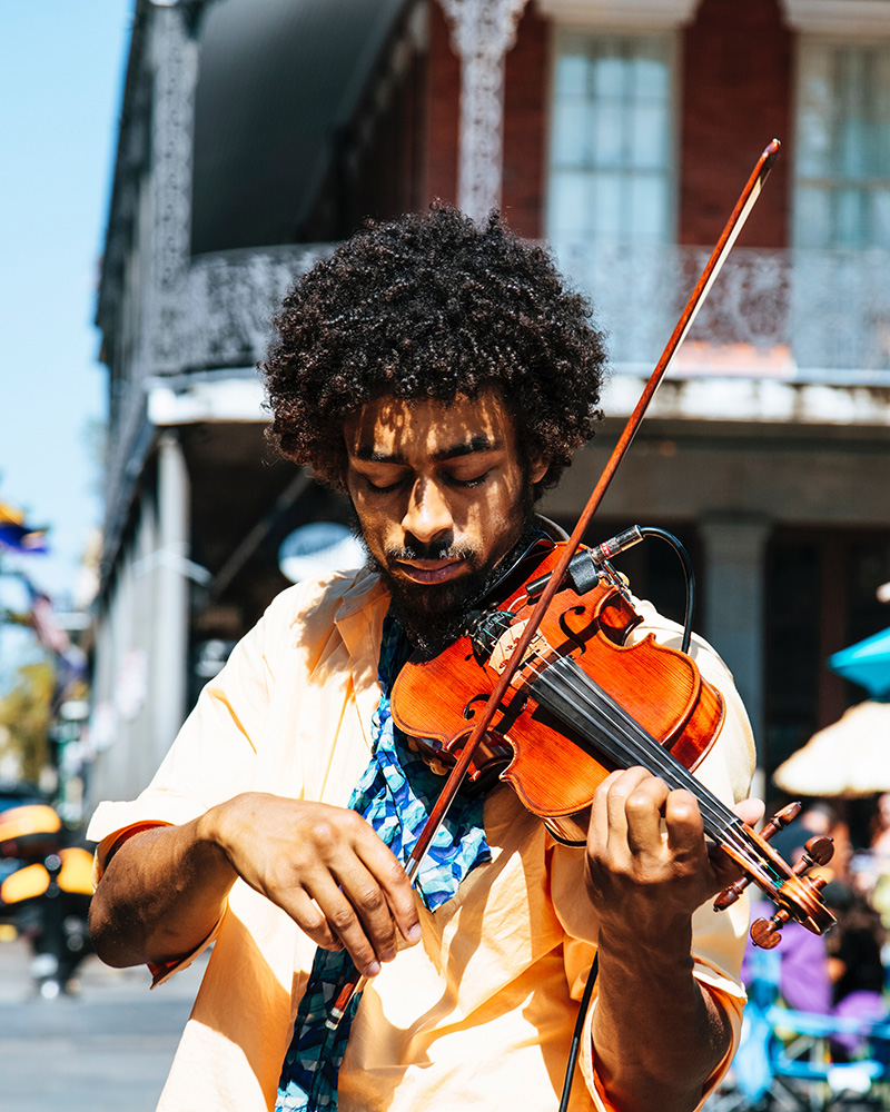 Musician playing the violin outside. Therapy for artists, creatives, musicians